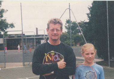 Photograph - Lake Entrance tennis coach Mike Spruzen with St Brendans pupil Tabitha Lancaster  2001, Lakes Post Newspaper