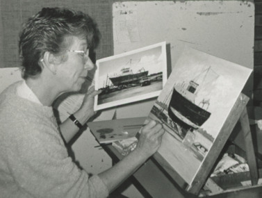 Photograph - Nora Young painting a fishing boat Lakes Entrance Victoria, Lakes Post Newspaper, 1/10/1996 12:00:00 AM