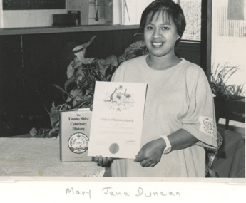 Photograph - Australian Citizenship, Lakes Post Newspaper, Mary Jane Duncan holding her Australian Citizenship Certificate, 1/05/1991 12:00:00 AM