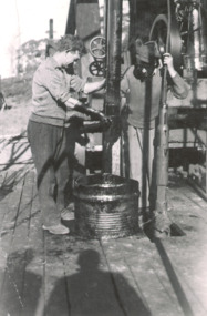 Photograph, Charlie May and Charlie Carpenter at the Mid West oil bore Lakes Entrance Victoria, 1940 c