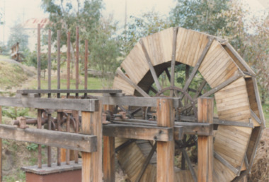 Photograph - Information Centre Orbost Victoria, Water wheel and stamper installed near the Slab Hut, 1989 c