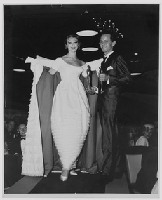 Photograph - Photographs, Photograph featuring Hall Ludlow and Diane Masters modelling Gown of the Year, 1959