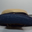side view showing blue underside of hat brim