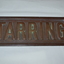Rectangular brass name plate for a house, front view