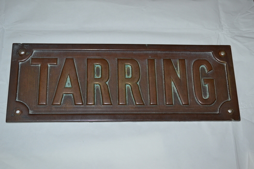 Rectangular brass name plate for a house, front view