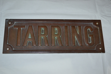 Rectangular brass name plate for a house, front view