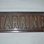 Rectangular brass name plate for a house, front view