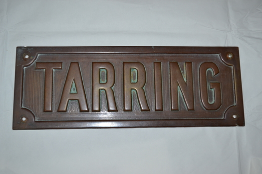 Rectangular brass name plate for a house, front view
