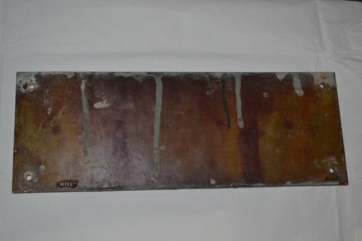 Rectangular brass name plate for a house, rear side
