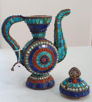 Image of ornamental teapot inlaid with lapis lazuli, coral and turquoise, with a decorative lid