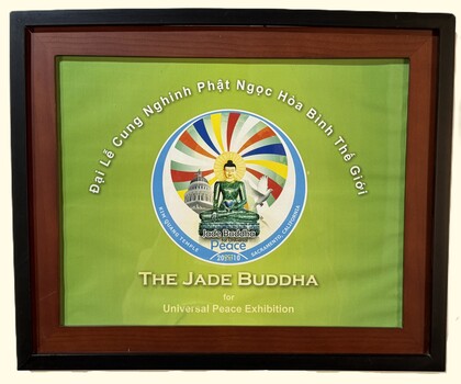 Framed image of Jade Buddha on green background