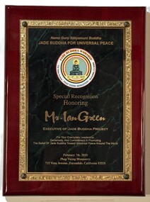 Plaque honoring Ian Green for his exemplary leadership, generosity, and commitment in promoting the belief of Jade Buddha toward universal peace around the world.