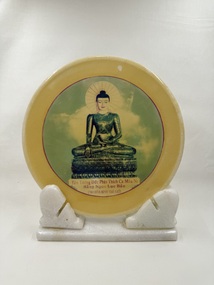 Front of marble souvenir plate on marble stand with print of the Jade Buddha
