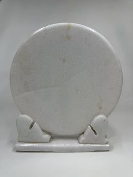 Back of marble souvenir plate on marble stand with print of the Jade Buddha