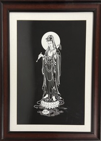 A framed print of Quan Yin in black and white