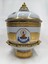 Front of Image of decorative vase with images and inscription