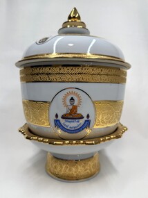 Front of Image of decorative vase with images and inscription