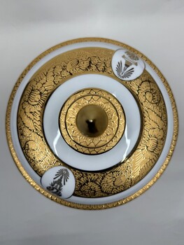 Top of decorative vase with images and inscription