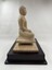 Image of side of wooden statue of the Buddha