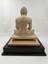 Image of back of wooden statue of the Buddha