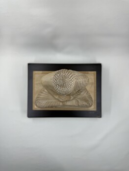 Image of top of wooden statue of the Buddha