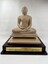 Image of front of wooden statue of the Buddha