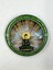 Front of a badge featuring the seated Jade Buddha surrounded by rays of light, with doves soaring above, commemorating its exhibition in San Diego, 2010.