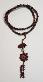 Memorabilia - Long mala with dharma wheel