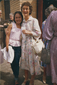 Photograph, Coral Watkins with Nhem Dy outside [Springvale] church on 29/1/84, 29/11/1984