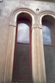 Pair of arched exterior windows with etched glass