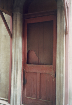 Rear door with wooden canopy
