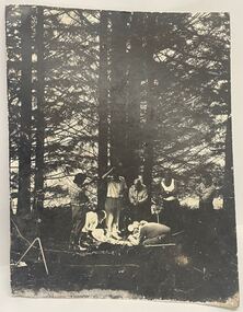 David Attenborough and film crew in a forest