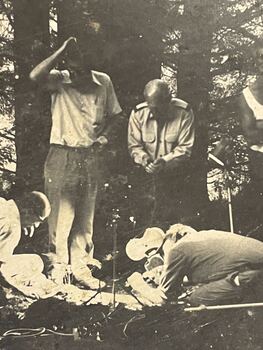 David Attenborough and film crew in a forest - Close up