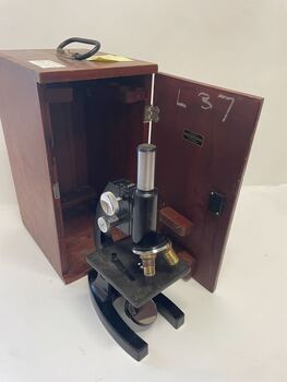Bausch and Lomb Optical Company Microscope in cabinet