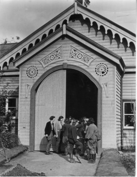 A group of mostly female students crowded around the entrance to the Pavilion