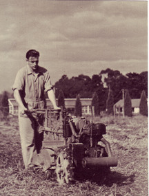 Photograph - Sepia print, Male Student Using Rotary Hoe, c. 1945