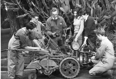 Photograph - Black and white print, Publicity Branch Victorian Department of Agriculture, George Grumont Demonstrating Maintenance on a Rotary Hoe, 1961-1962