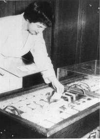 Photograph - Black and white print, Woman Working in Seed Testing, c. 1970
