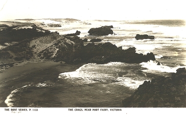 Craggy outcrops with turbulent seas washing into a bay