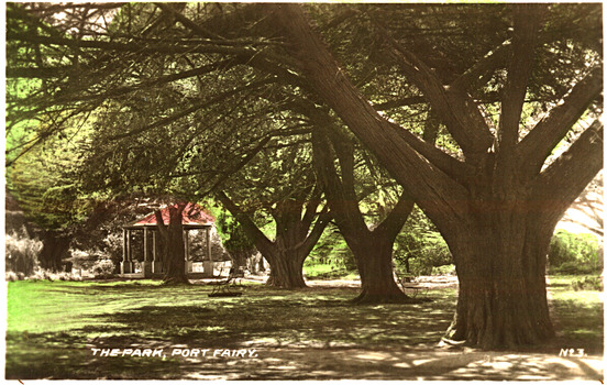 the rotunda in with large cyprus trees and benches underneath