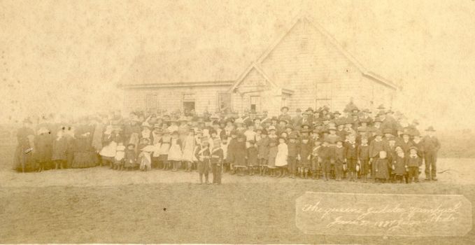 Weatherboard building with children posed in front celebrating Queen Victoria’s Jubilee Celebration 1887