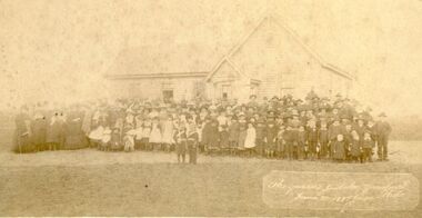 Weatherboard building with children posed in front celebrating Queen Victoria’s Jubilee Celebration 1887