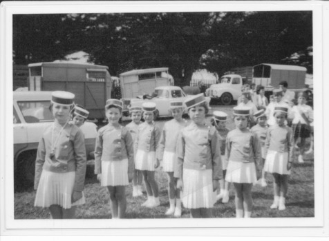 Younger marching girls standing at attention in the Port Fairy show grounds