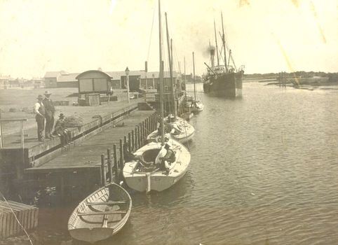 S.s.Casino steaming down to berth at her wharf on the left fishing boats in foreground
