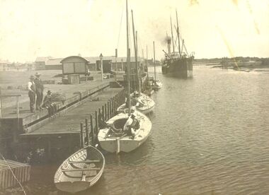 S.s.Casino steaming down to berth at her wharf on the left fishing boats in foreground
