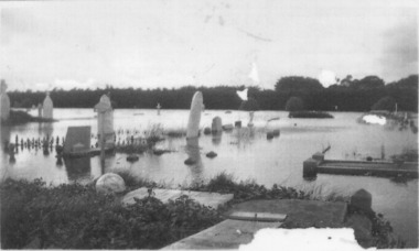 Headstones in flood water at cemetery 