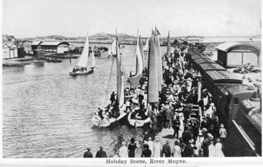 Couta boats at the Moyne river wharf. Train on right