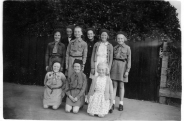 group of girl guides some in uniform 