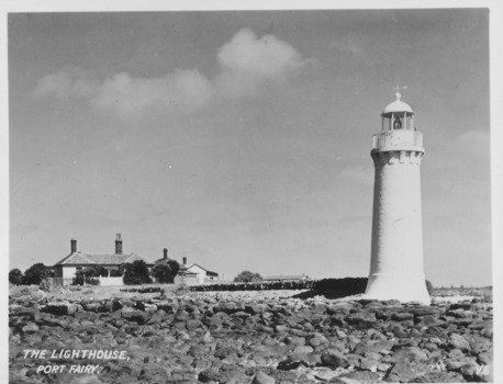 Lighthouse keeper’s cottages with lighthouse to the right