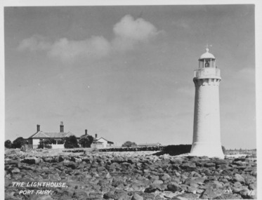 Lighthouse keeper’s cottages with lighthouse to the right